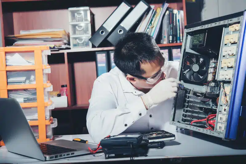 computer technician repairing a computer.