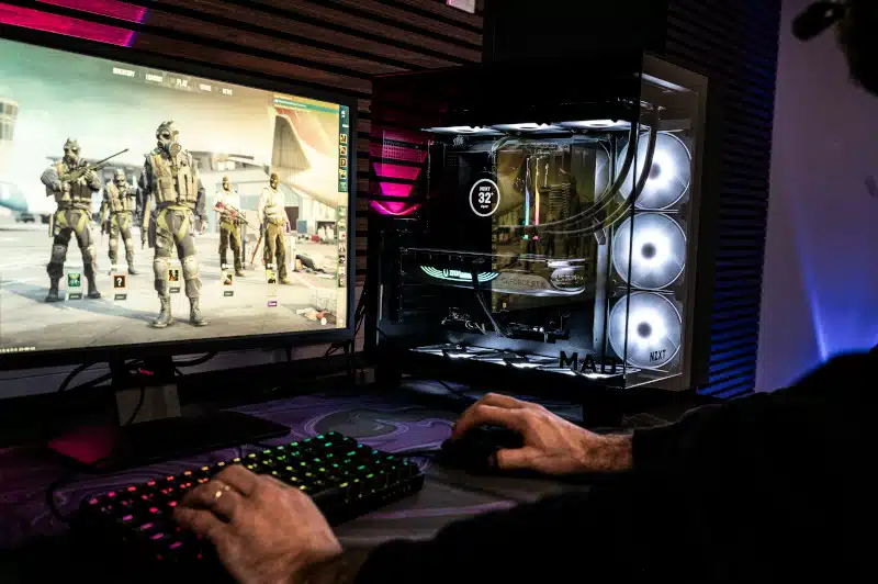 A man is playing a video game on his computer.
